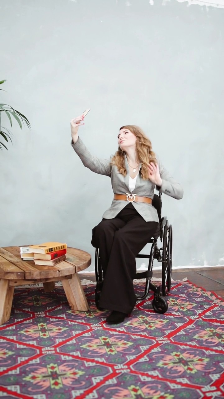 Happy Lady in Wheelchair Taking Selfie Stock Video